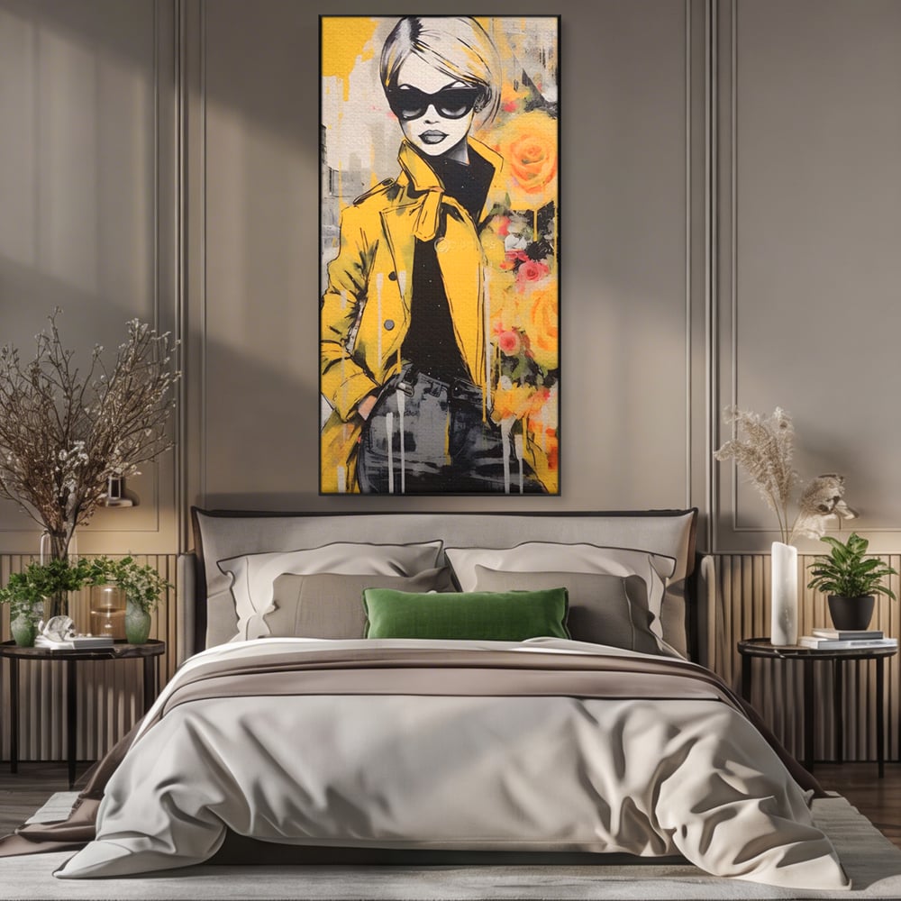 Tablou canvas cu tablou canvas cu femeie in jacheta galbena, in rama de aluminiu negru, pe perete intr-un dormitor